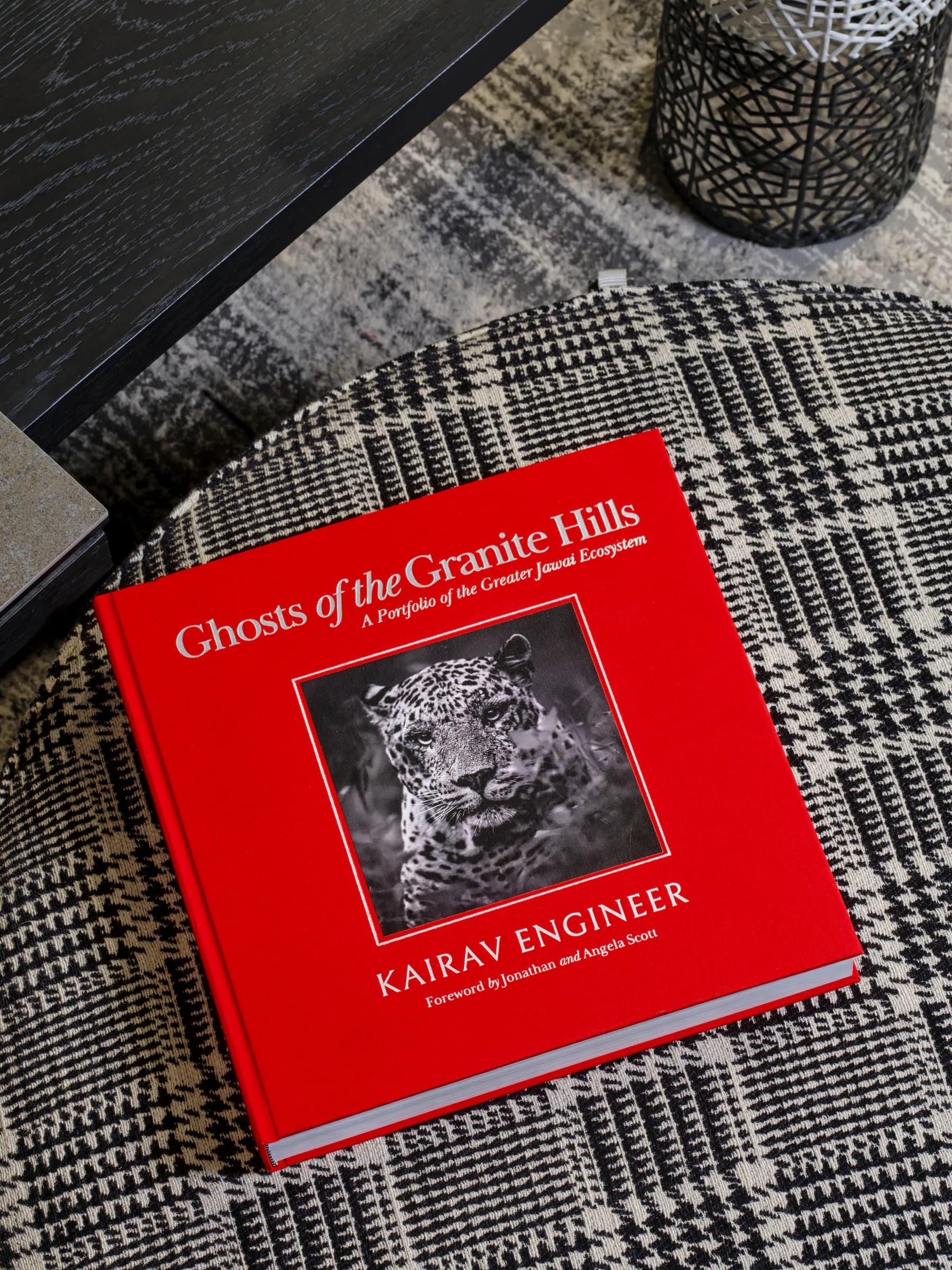 Red clothbound Ghosts of the Granite Hills book displayed in an interior